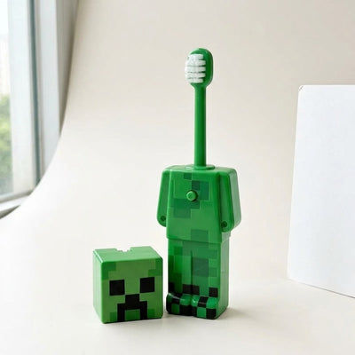 Creeper Minecraft toothbrush with the brush popped up and the head cap beside it