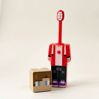 JJ Minecraft toothbrush with the brush popped up and the head cap beside it
