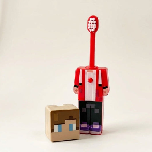JJ Minecraft toothbrush with the brush popped up and the head cap beside it