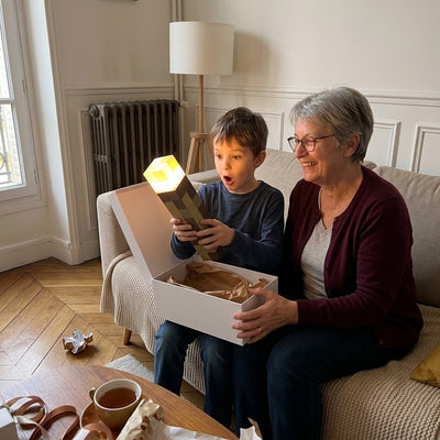 Boy unwrapping the Pixel Torch with his grandmother
