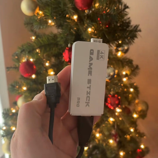RetroStick Pro 4K HDMI stick in front of the Christmas tree