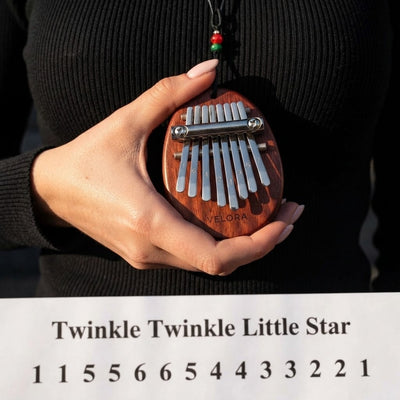 Velora Kalimba™ | 8 tines, free 30 song book, her first song the same evening